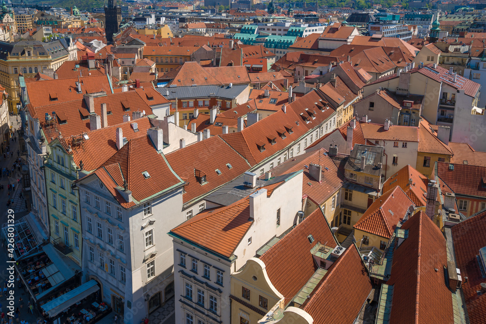 Above the roofs of old Prague is a sunny April day. Czech Republic