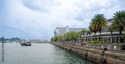  View of VivoCity from Sentosa Gateway. On the embankment tourists stroll photo