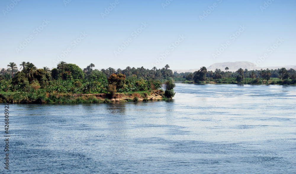 Cruising on Nile River. Nile river shore, southern Egypt. Africa Cruising on Nile River. Nile river shore, southern Egypt. Africa