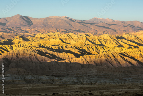 Eroded landscape and rock towers in Zanda soil forest photo