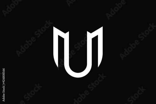 Minimal elegant monogram art logo. Outstanding professional trendy awesome artistic MU UM initial based Alphabet icon logo. Premium Business logo White color on black background.
