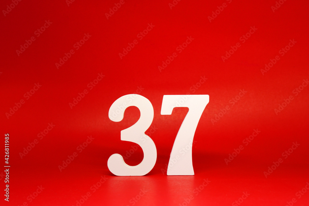 Thirty Seven ( 37 ) white number wooden Isolated Red Background with Copy Space - New promotion 37% Percentage Business finance Concept Thirty Seven ( 37 ) white number wooden Isolated Red Background with Copy Space - New promotion 37% Percentage Business finance Concept