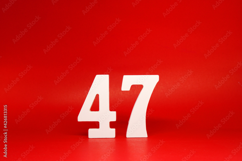Forty Seven ( 47 ) white number wooden Isolated Red Background with Copy Space - New promotion 47% Percentage Business finance Concept Forty Seven ( 47 ) white number wooden Isolated Red Background with Copy Space - New promotion 47% Percentage Business finance Concept