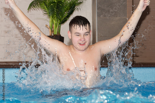 A Happy teen swims in pool, water © Alexander
