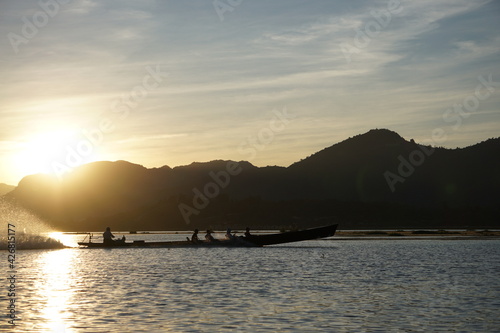  Boat sunset on the Inle Lake in Myanmar