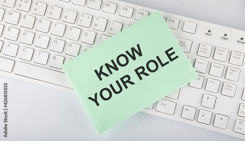 text Know Your Role on envelope on keyboard on the white background text Know Your Role on envelope on keyboard on the white background