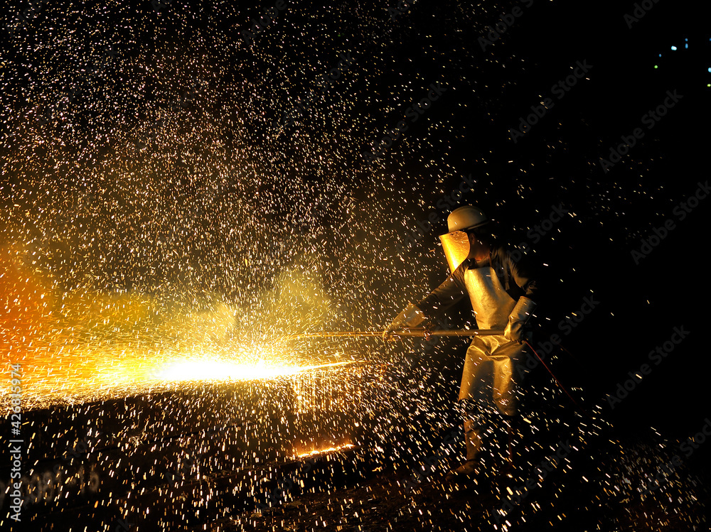 Welder worker in steel plant
