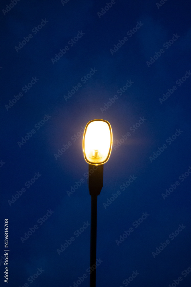 Street light pole on dark blue sky background at during the night. Coppy space Street light pole on dark blue sky background at during the night. Coppy space