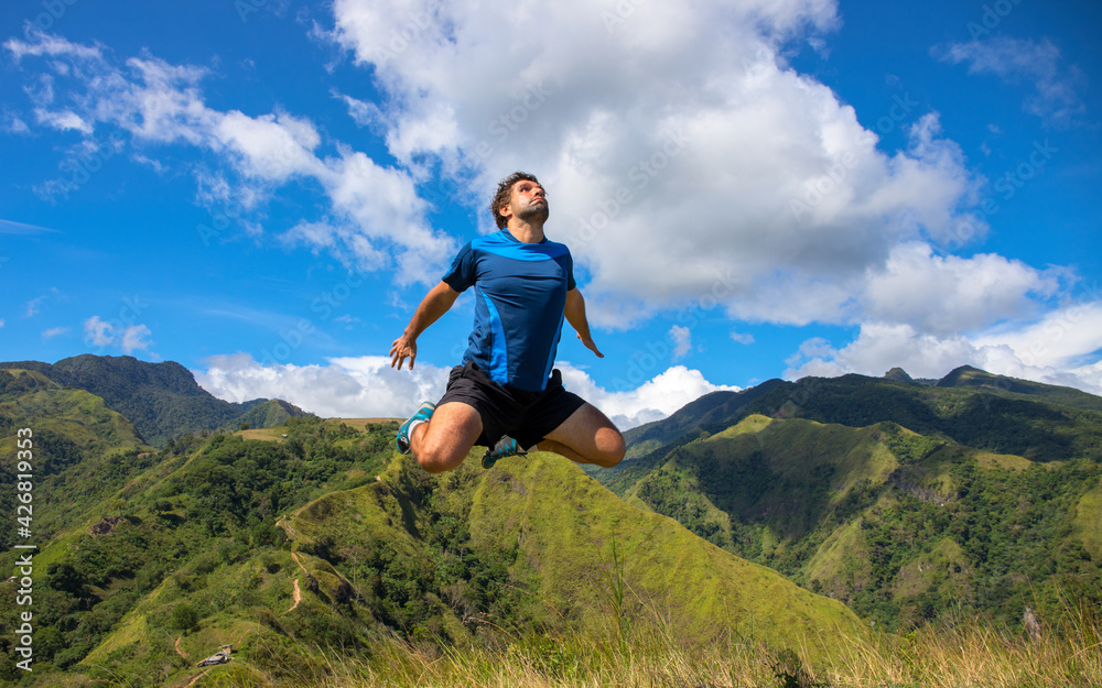 Trekker flying on natural mountain landscape. Funny concept photo. Tourist travels through the mountains. Photos of holidays in beautiful places. Tracker conquers mountain peaks. Outdoor activities. Trekker flying on natural mountain landscape. Funny concept photo. Tourist travels through the mountains. Photos of holidays in beautiful places. Tracker conquers mountain peaks. Outdoor activities.