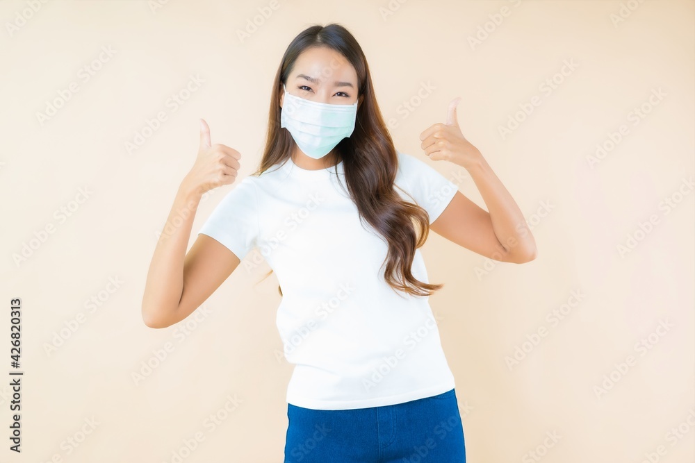 Portrait beautiful young asian woman smile with action wear mask Portrait beautiful young asian woman smile with action wear mask