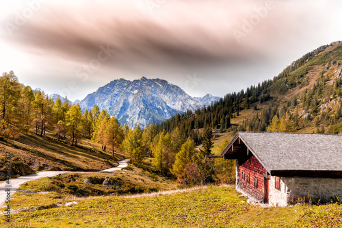 Alpine cabin in front of Watzmann in Berchtesgadener Land, Bavaria, Germany, in autumn.