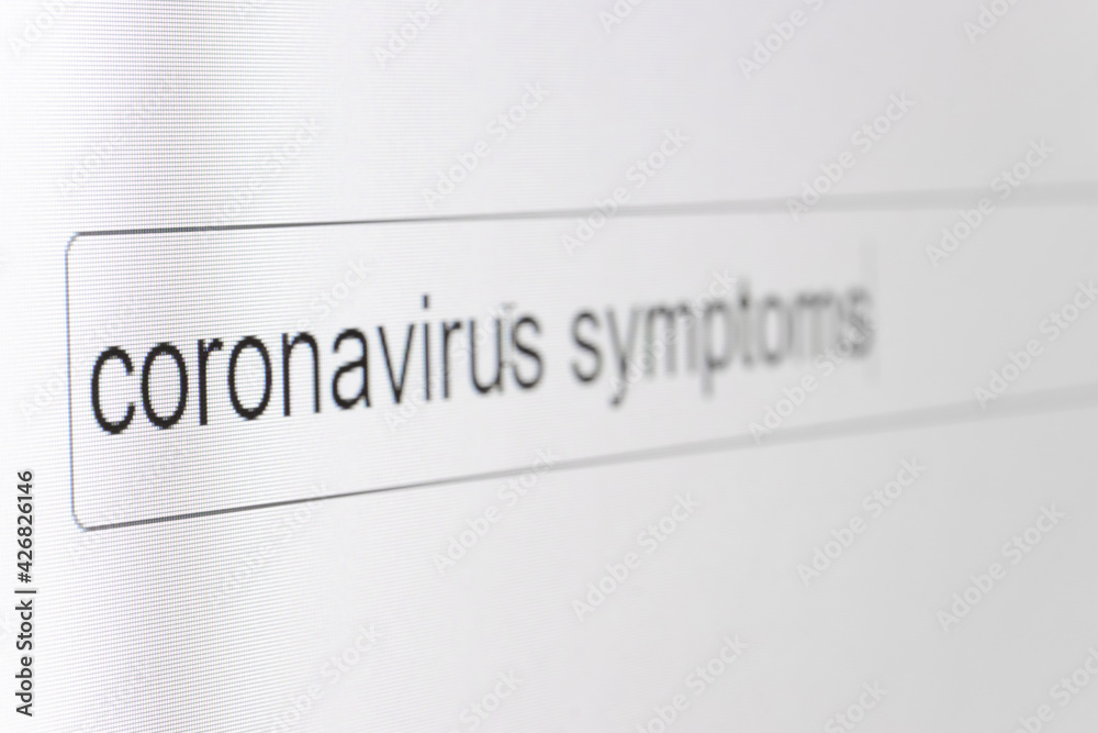 Search bar on a computer monitor with the question Coronavirus symptoms. Searching for information on the Internet, close up. Search bar on a computer monitor with the question Coronavirus symptoms. Searching for information on the Internet, close up.