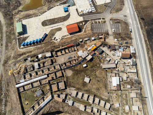 Aerial drone view, city waste management facility near asphalt road in Romania.