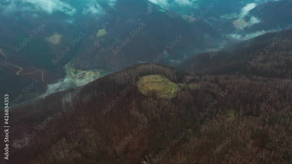 Aerial drone video of a mountain landscape in a cold foggy day Aerial drone video of a mountain landscape in a cold foggy day