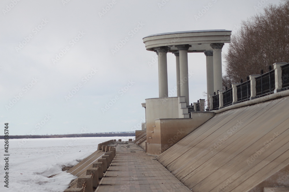 Beautiful marble embankment on the banks of the Amur River in winter.