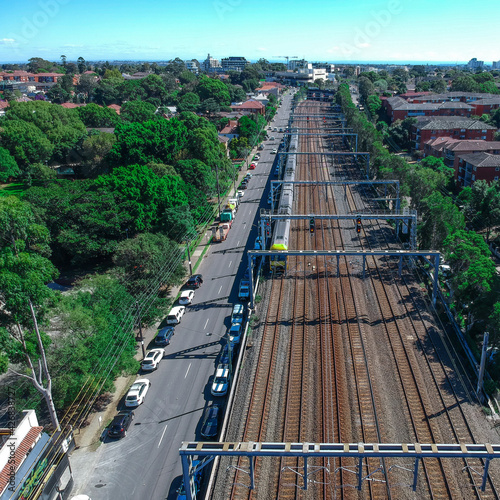 Photography Drone Aerial view of a train tracks in an inner suburb of Sydney with views of r