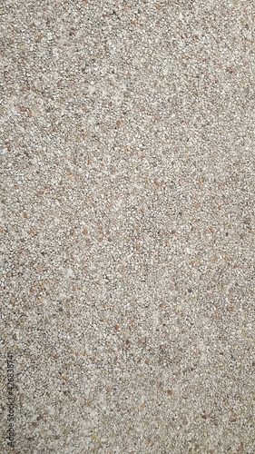 Small stones made of ground, brown, gray, white arranged in detail. Can be background