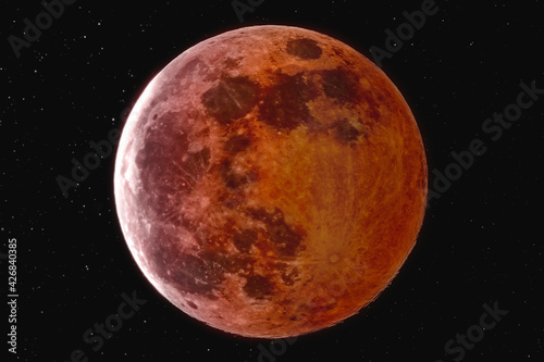 The picture shows the blood moon with stars over the city of Bottrop in North Rhine-Westphalia with a clear night sky.