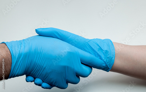 hands in medical gloves on a white background