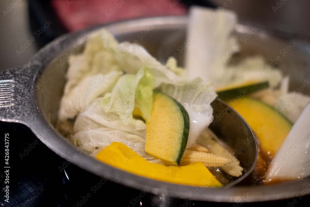 Various fresh vegetable in hot pot for Sukiyaki. Selective focus. Various fresh vegetable in hot pot for Sukiyaki. Selective focus.