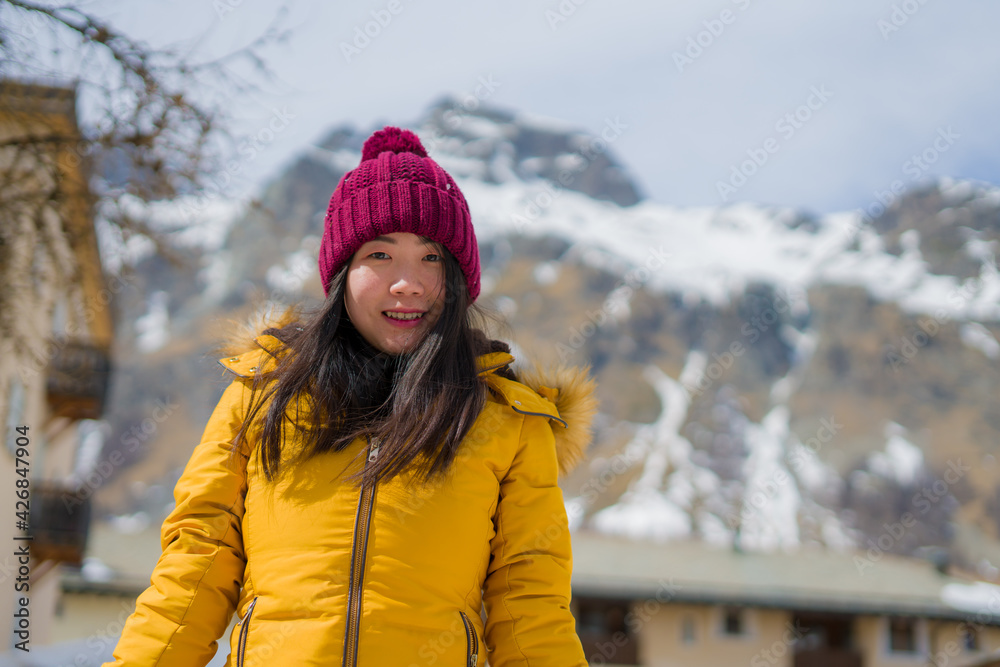 winter lifestyle portrait of young happy and attractive Asian Japanese woman at beautiful snow mountains landscape enjoying Easter holidays in Swiss Alps winter lifestyle portrait of young happy and attractive Asian Japanese woman at beautiful snow mountains landscape enjoying Easter holidays in Swiss Alps