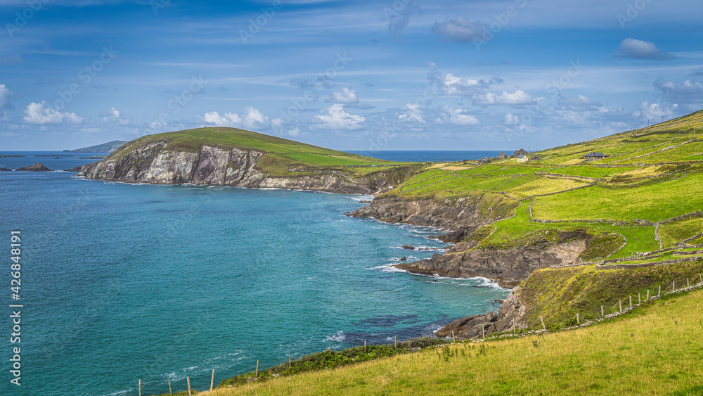 Beautiful coastline with cliffs and turquoise water. Small Coumeenoole Beach and Slea Head in Dingle Peninsula, Wild Atlantic Way, Kerry, Ireland