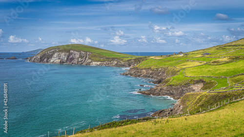 Beautiful coastline with cliffs and turquoise water. Small Coumeenoole Beach and Slea Head in Dingle Peninsula, Wild Atlantic Way, Kerry, Ireland