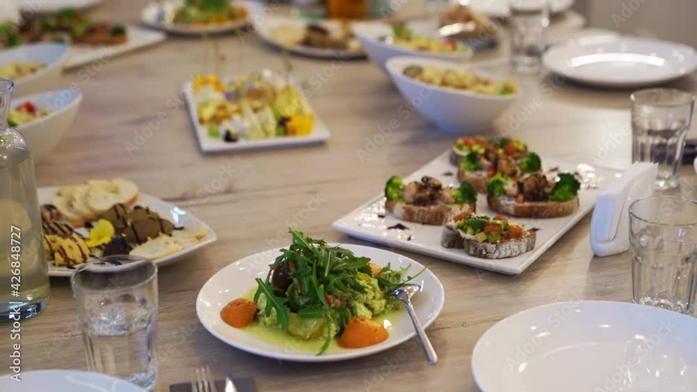 serving the table with appetizers and salads for the holiday. serving the table with appetizers and salads for the holiday.