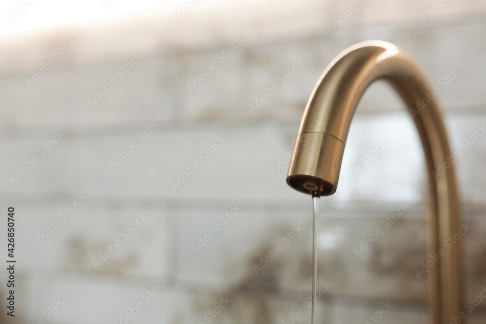 Tap with flowing water. Faucet in the kitchen. Tap with flowing water. Faucet in the kitchen.