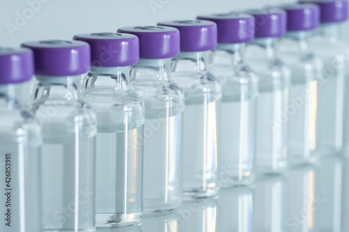 MANY VIALS OF COVID VACCINES LINED UP. GLOBAL VACCINATION CAMPAIGN AGAINST CORONAVIRUS PANDEMIC. CENTAURUS SUB VARIANT.