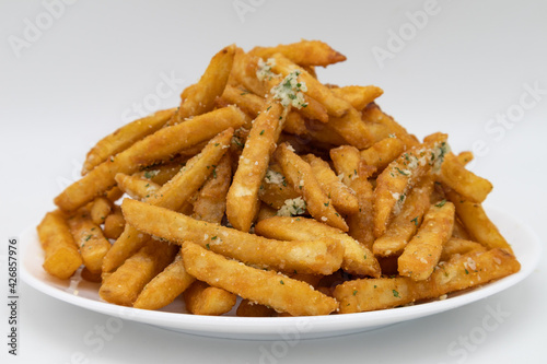 Large Pile of French Fries with Truffle Oil on a White Plate
