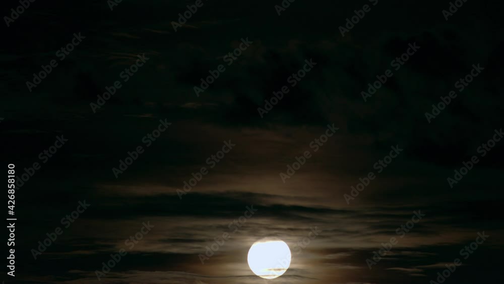 Time lapse os full moon behind clouds - night sky Time lapse os full moon behind clouds - night sky