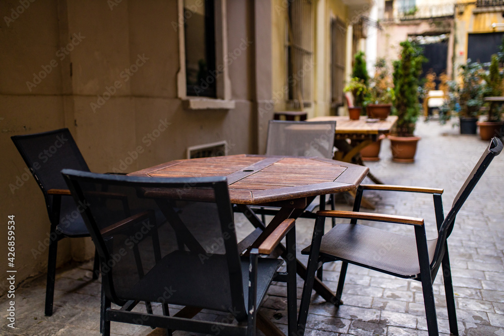 Empty tables and chairs , nobody tourist in the street curfew tourism