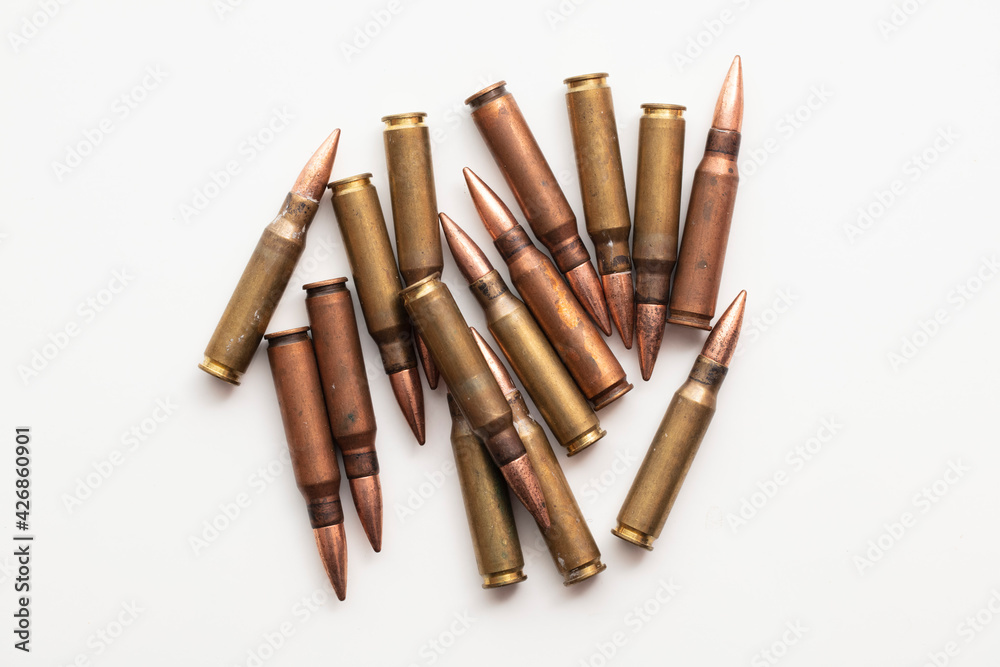 A group of bullet ammunition shells on a white background