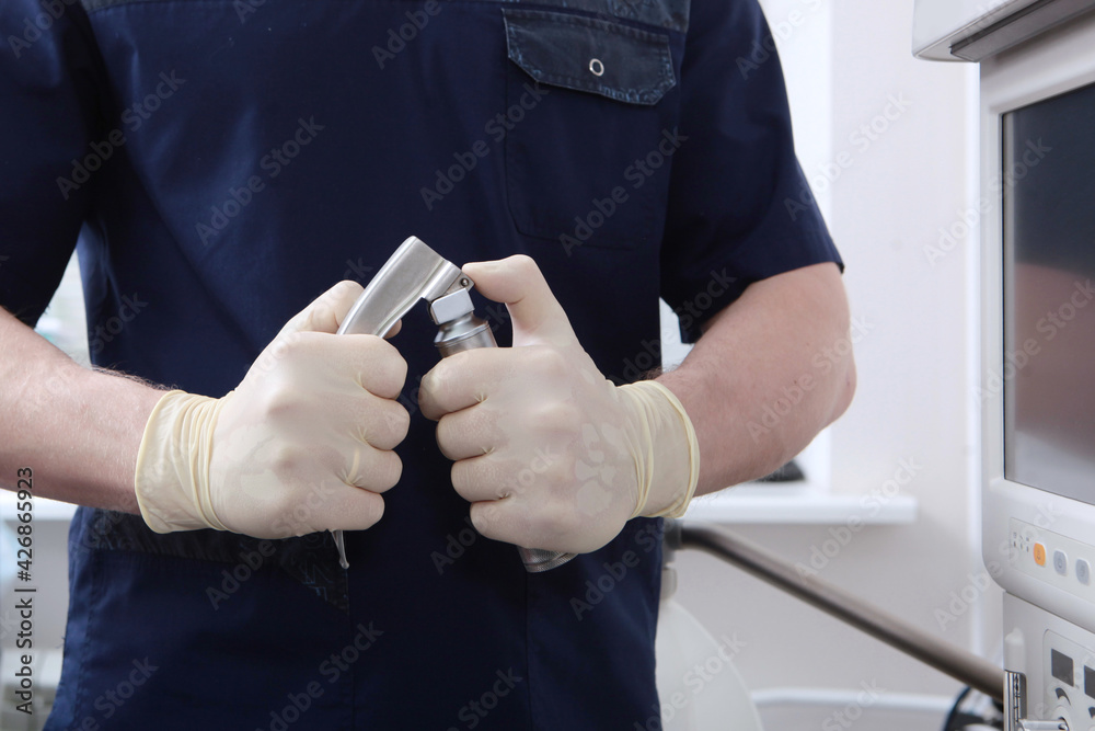 An anesthesiologist with laryngoscope in his hands.Tracheal intubation