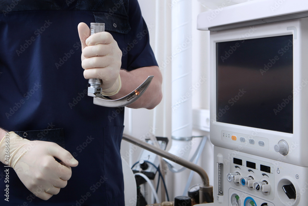 Laryngoscope in the hands of an anesthesiologist.Tracheal intubation