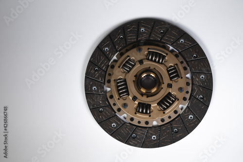 New clutch disc on gray background, new transmission parts