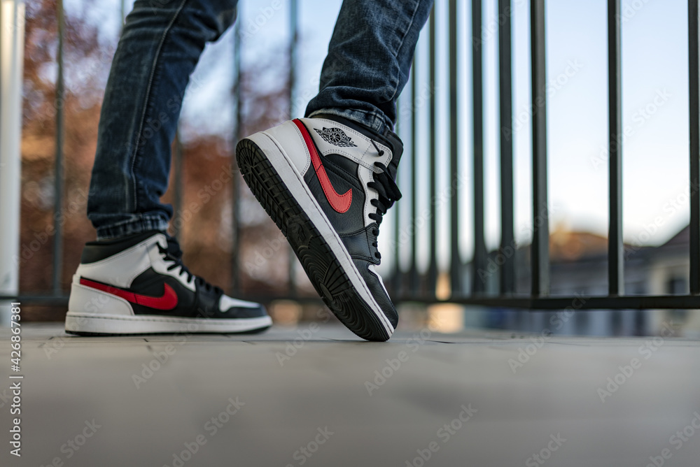 Nike Jordan 1 Mid Black Chile Red White shoes Photos | Adobe Stock
