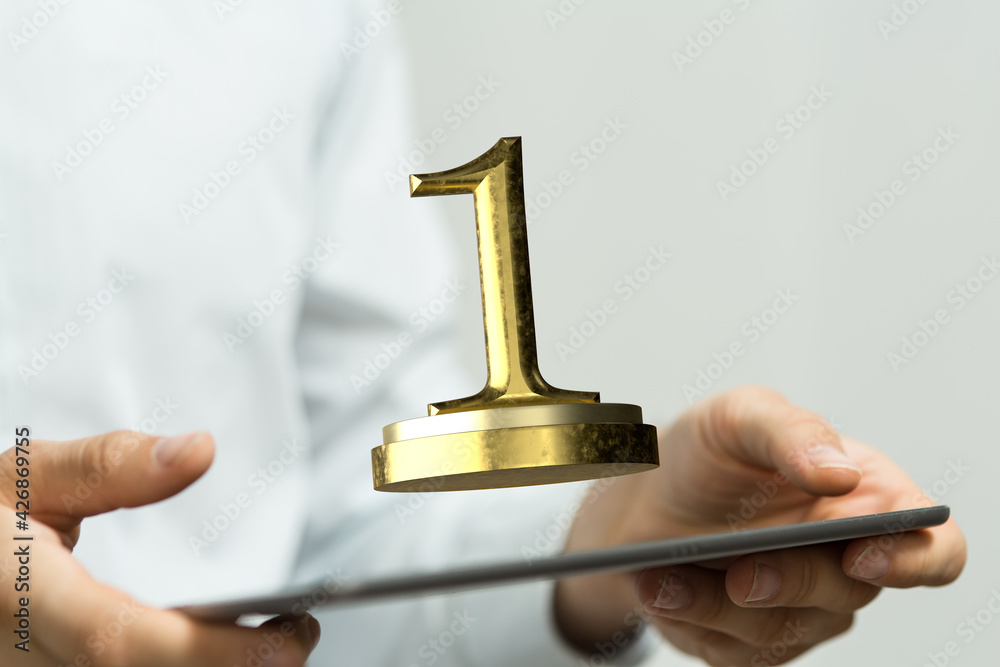 winner first place award in hand winner first place award in hand