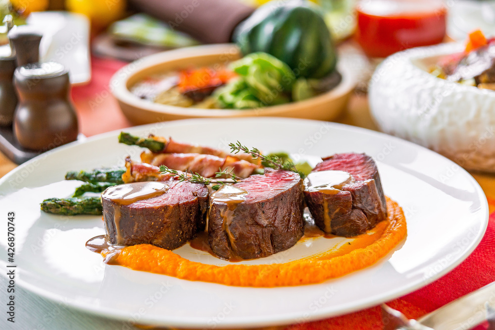 Served table in a restaurant with meat dishes Served table in a restaurant with meat dishes