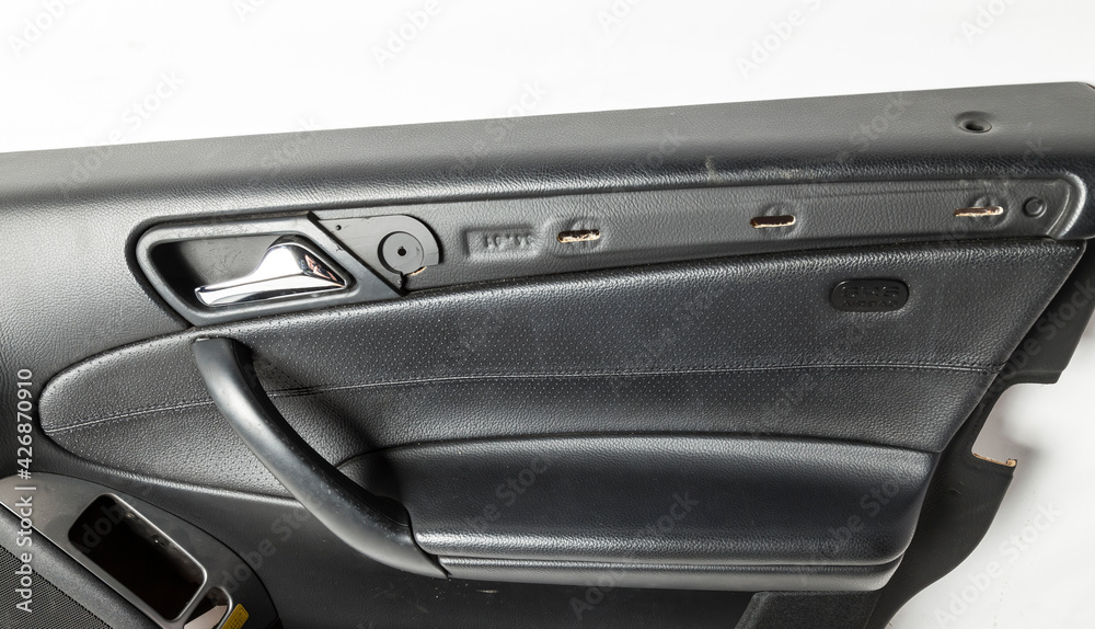 Car door trim with black leather upholstery on a white isolated background for repair and replacement in a car service. Spare parts catalog.
