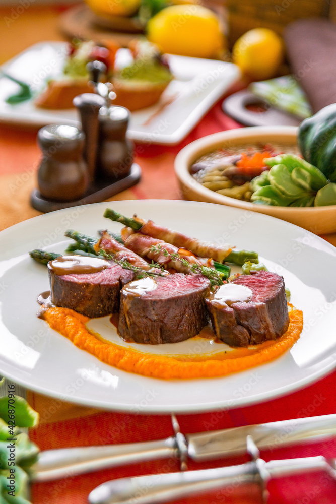 Served table in a restaurant with meat dishes Served table in a restaurant with meat dishes