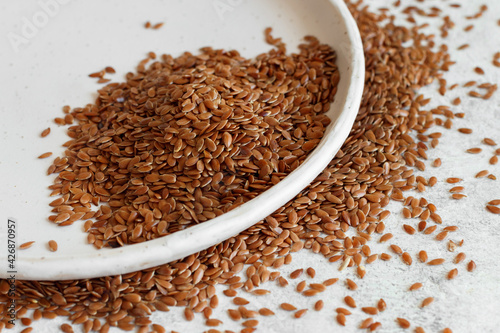 Raw Flax seeds in a ceramic plate