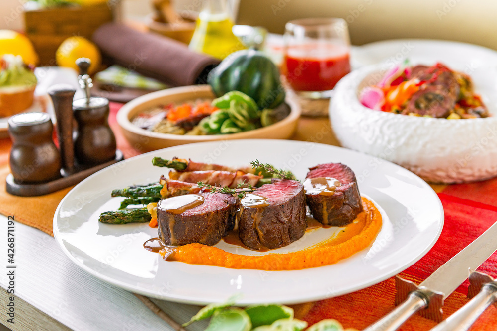 Served table in a restaurant with meat dishes Served table in a restaurant with meat dishes