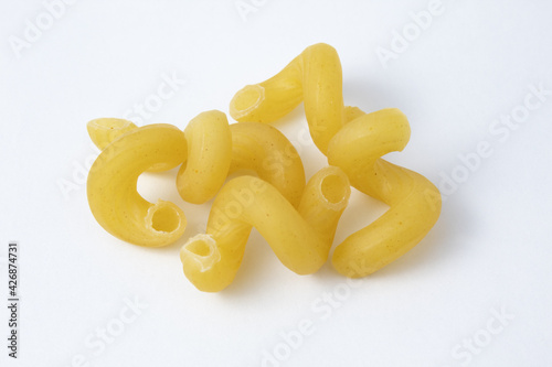 Group of cavatappi or cellentani pasta uncooked. Mac and cheese noodles.
