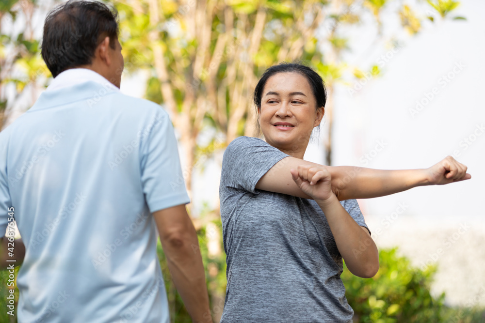 senior asian woman stretching and exercising outdoors senior asian woman stretching and exercising outdoors