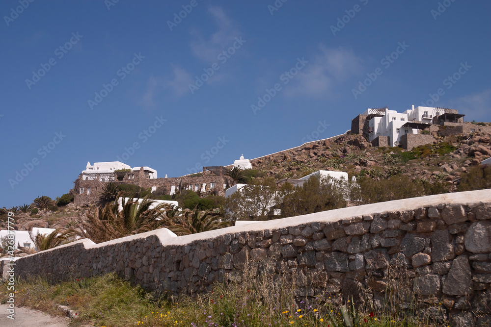 Empty whitewashed little houses, without people, in spring, on the island of Mykonos, Cyclades islands in the Aegean sea. Charming place not far from Elia Beach.