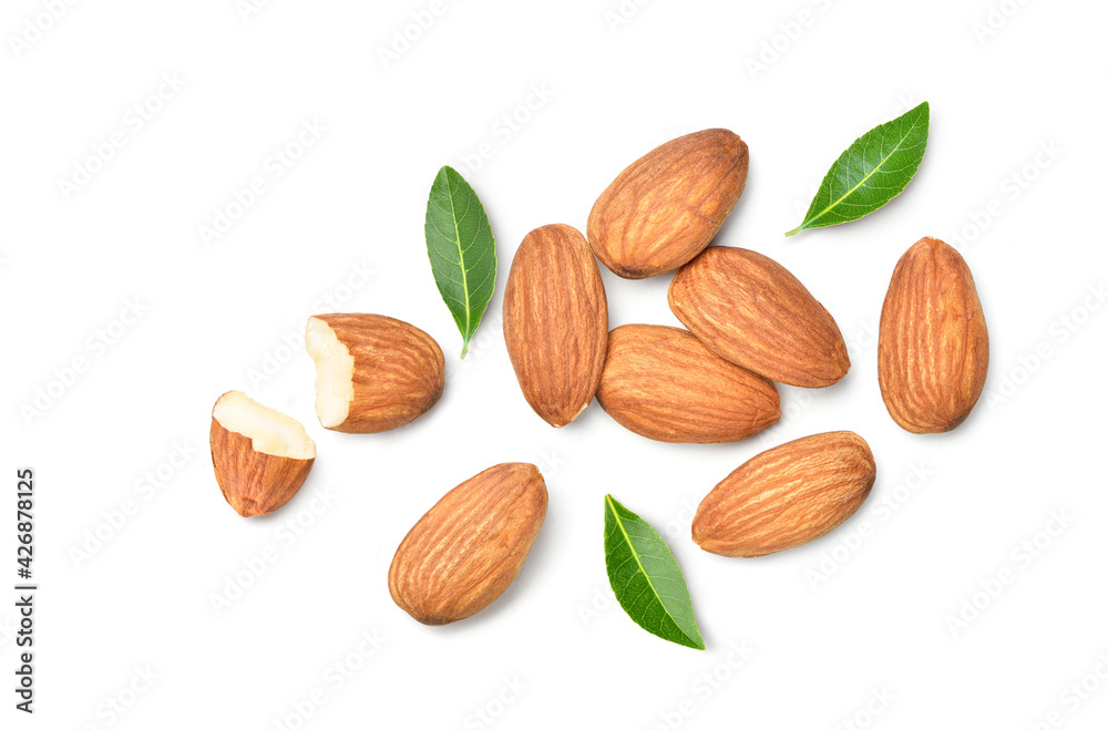 Flat lay (top view) of Almond nuts with leaves on white background. Flat lay (top view) of Almond nuts with leaves on white background.