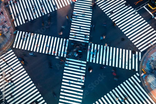 Photography Traffic and people cross a busy intersection in Ginza