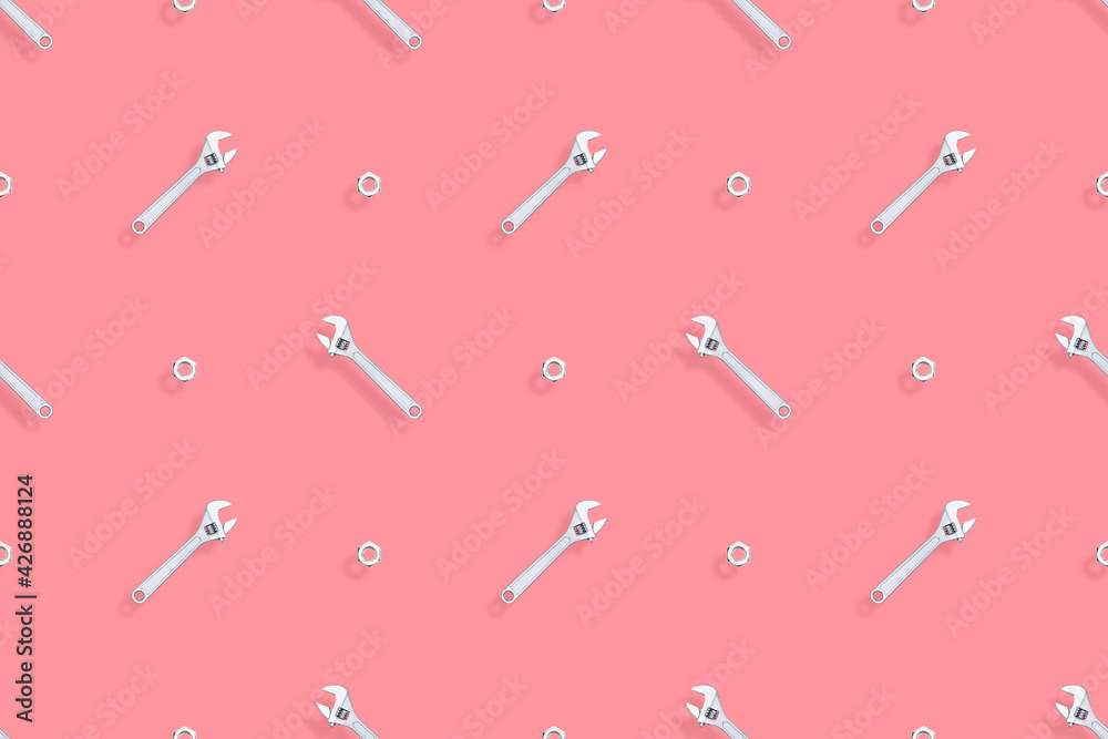 Adjustable metal wrench seamless pattern. Background from a metal wrench and nut. Adjustable metal wrench seamless pattern. Background from a metal wrench and nut.
